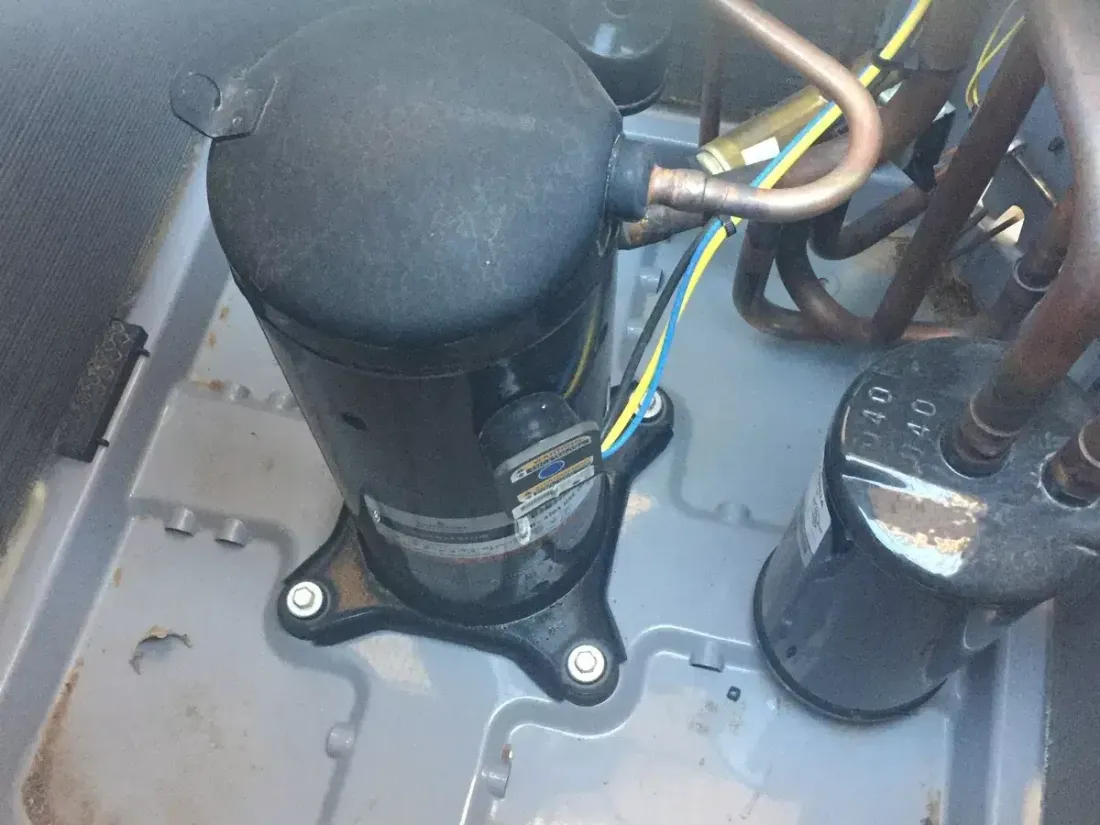Air conditioner compressor and connected wiring