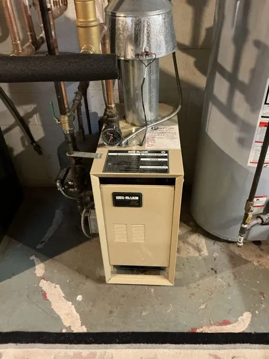 Basement boiler and connected expansion tank piping