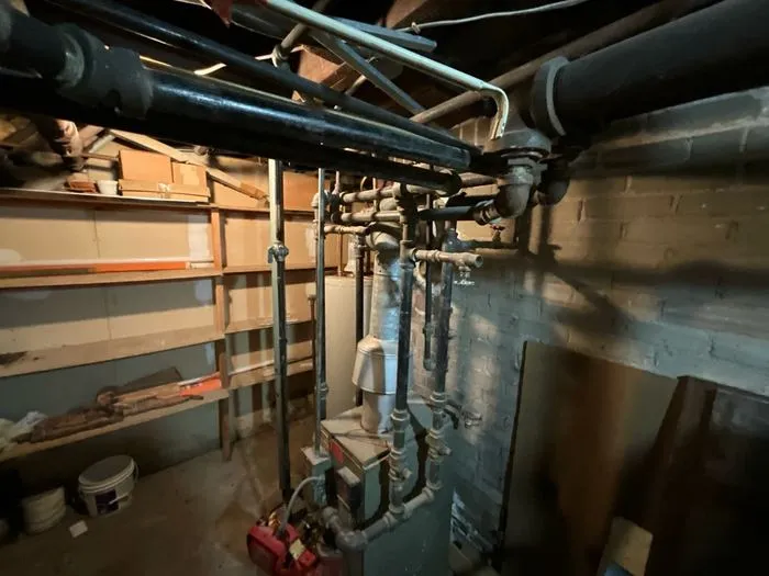 Boiler and heating pipes in a basement