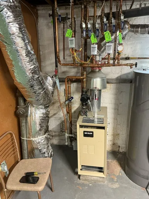 Boiler with several heating zone valves and pipes