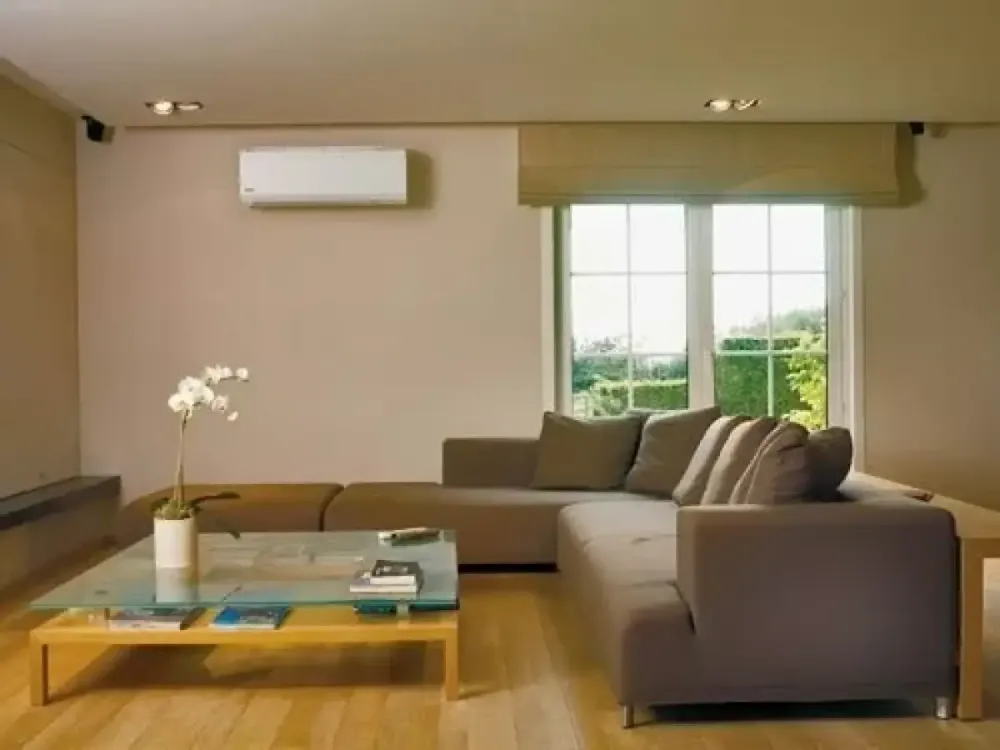 Ductless air conditioner mounted in a living room