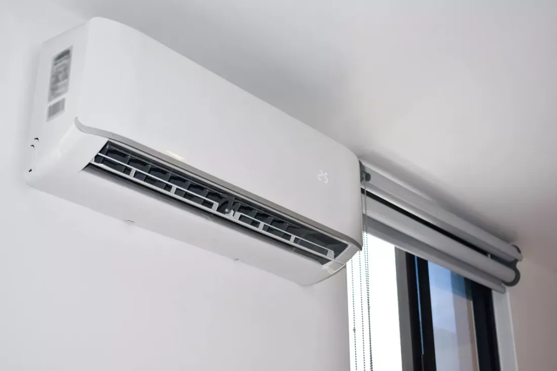 Ductless indoor unit mounted above a window