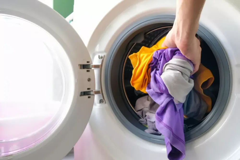 Loading clothes into a washing machine