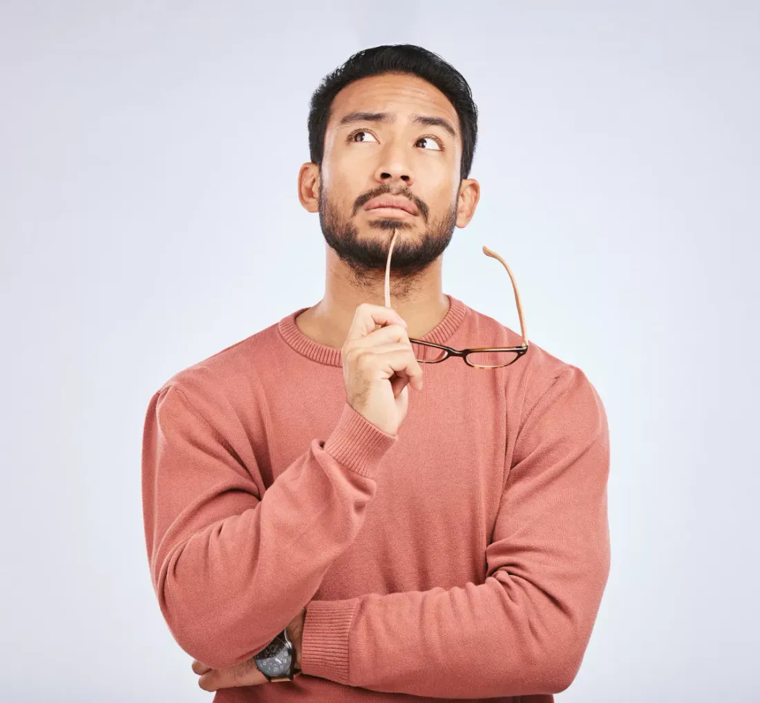 Man thinking with his hand on his chin