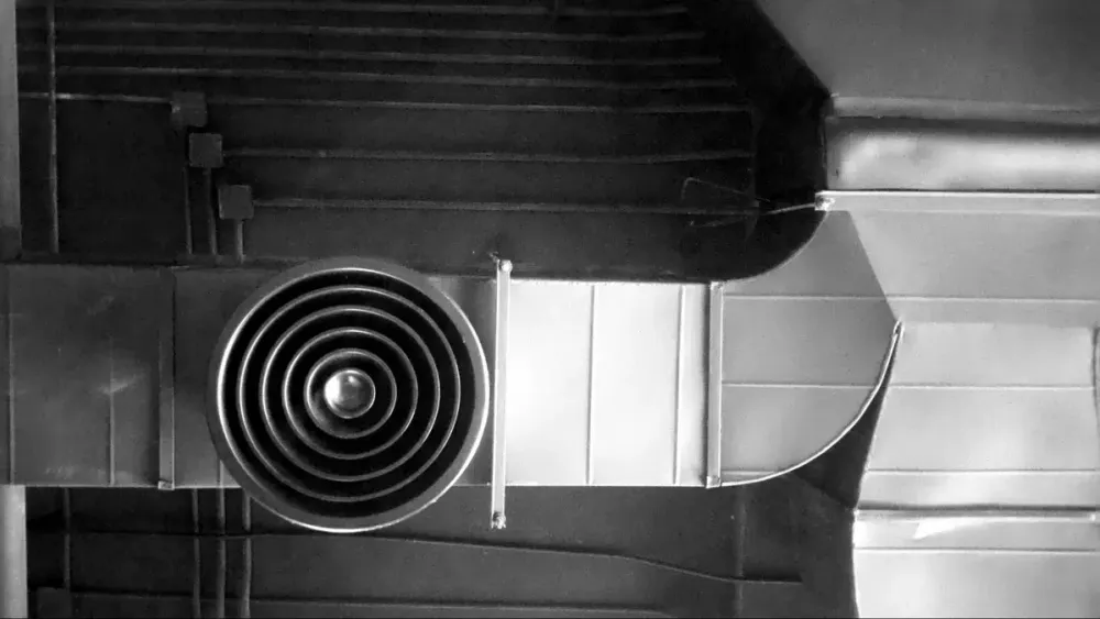 Metal HVAC ductwork and a ceiling vent
