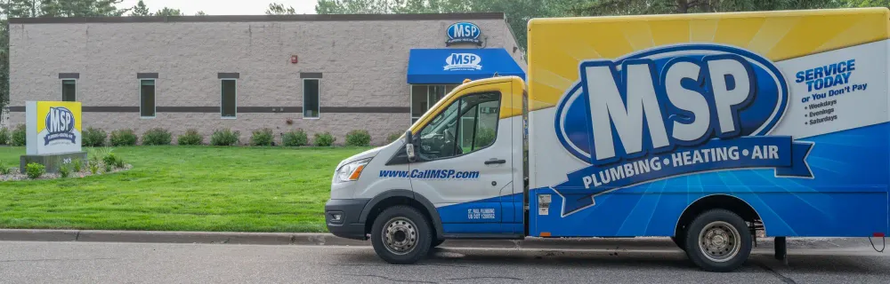 MSP service van parked outside the company building