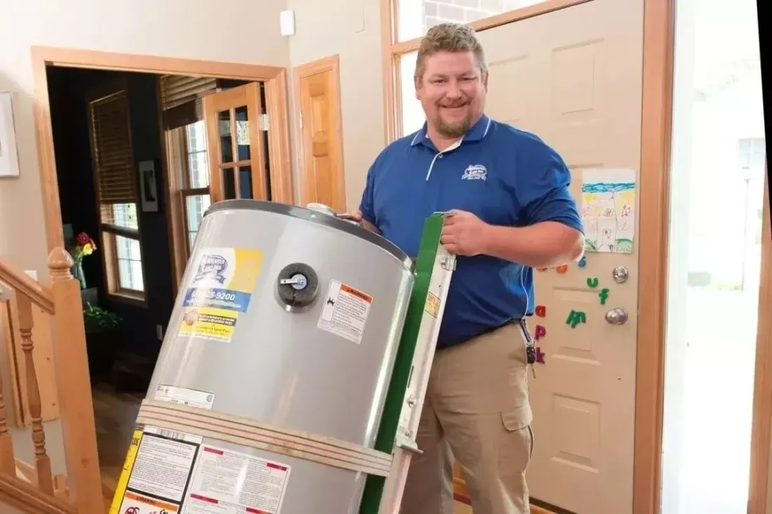 MSP technician moving a tank water heater