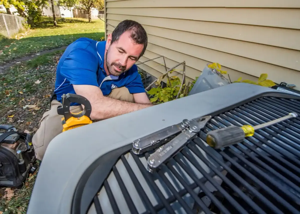 MSP technician servicing an outdoor air conditioner