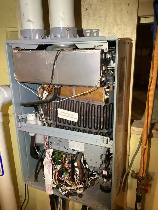 Open tankless water heater during cleaning and descaling