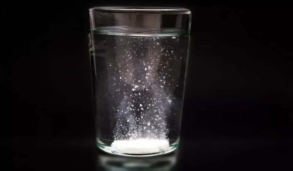 Particles suspended in a glass of water