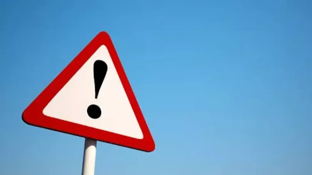 Red warning triangle with an exclamation mark