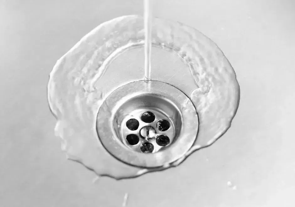 Water swirling toward a sink drain