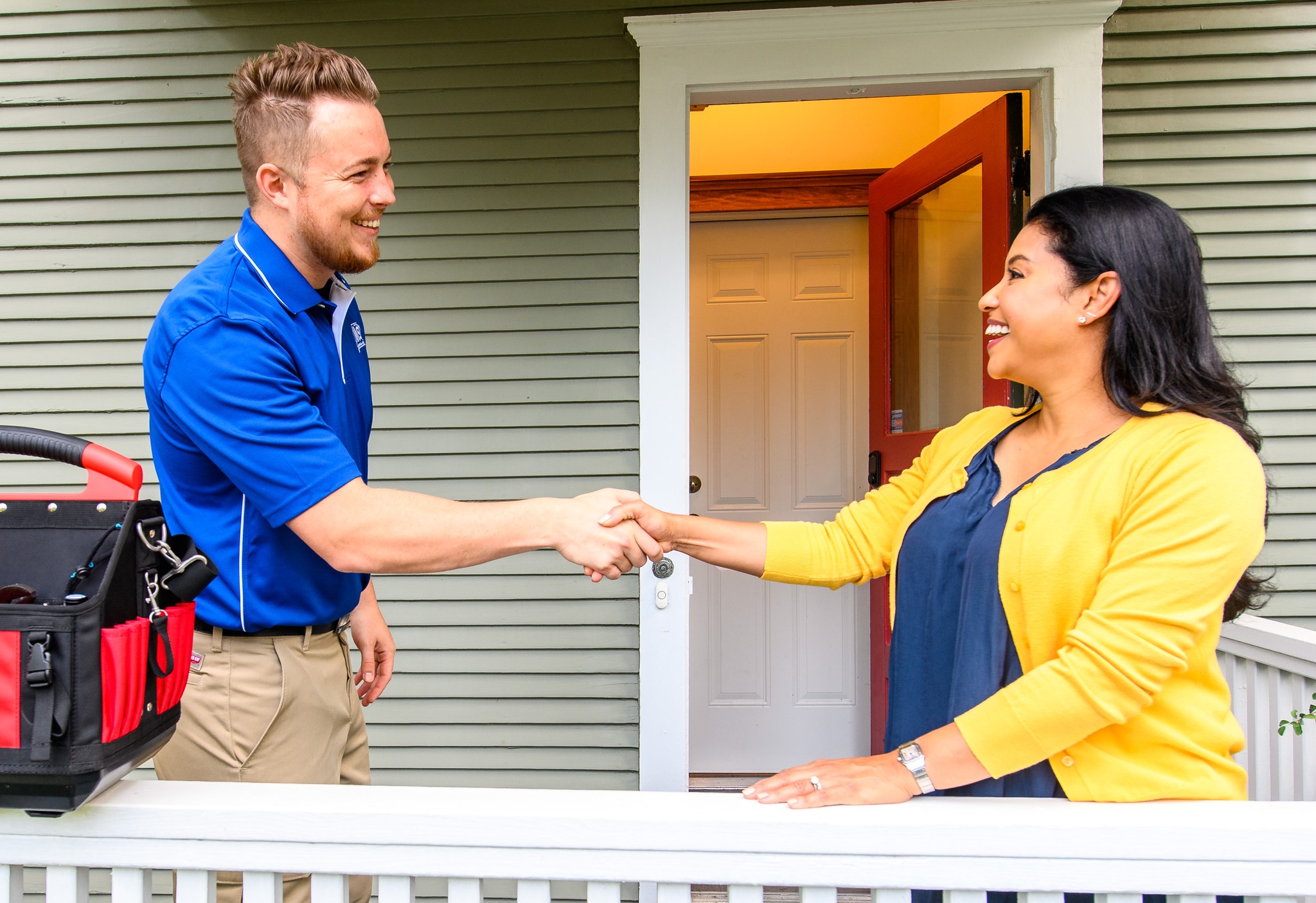 Technician greeting customer with handshake
